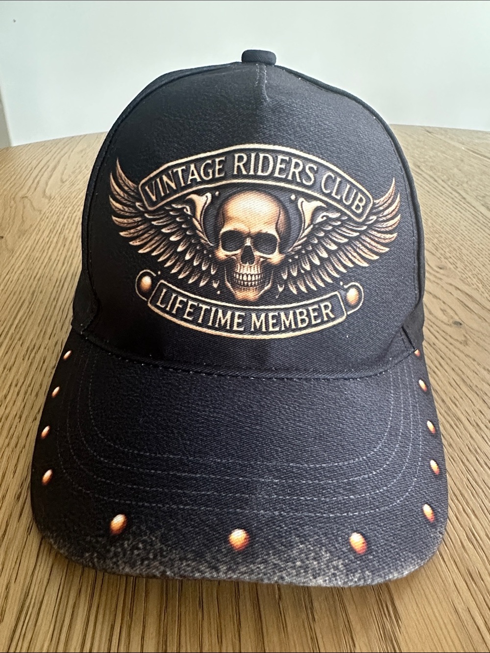 Vintage Black Hat with Gold Skull Wing Emblem